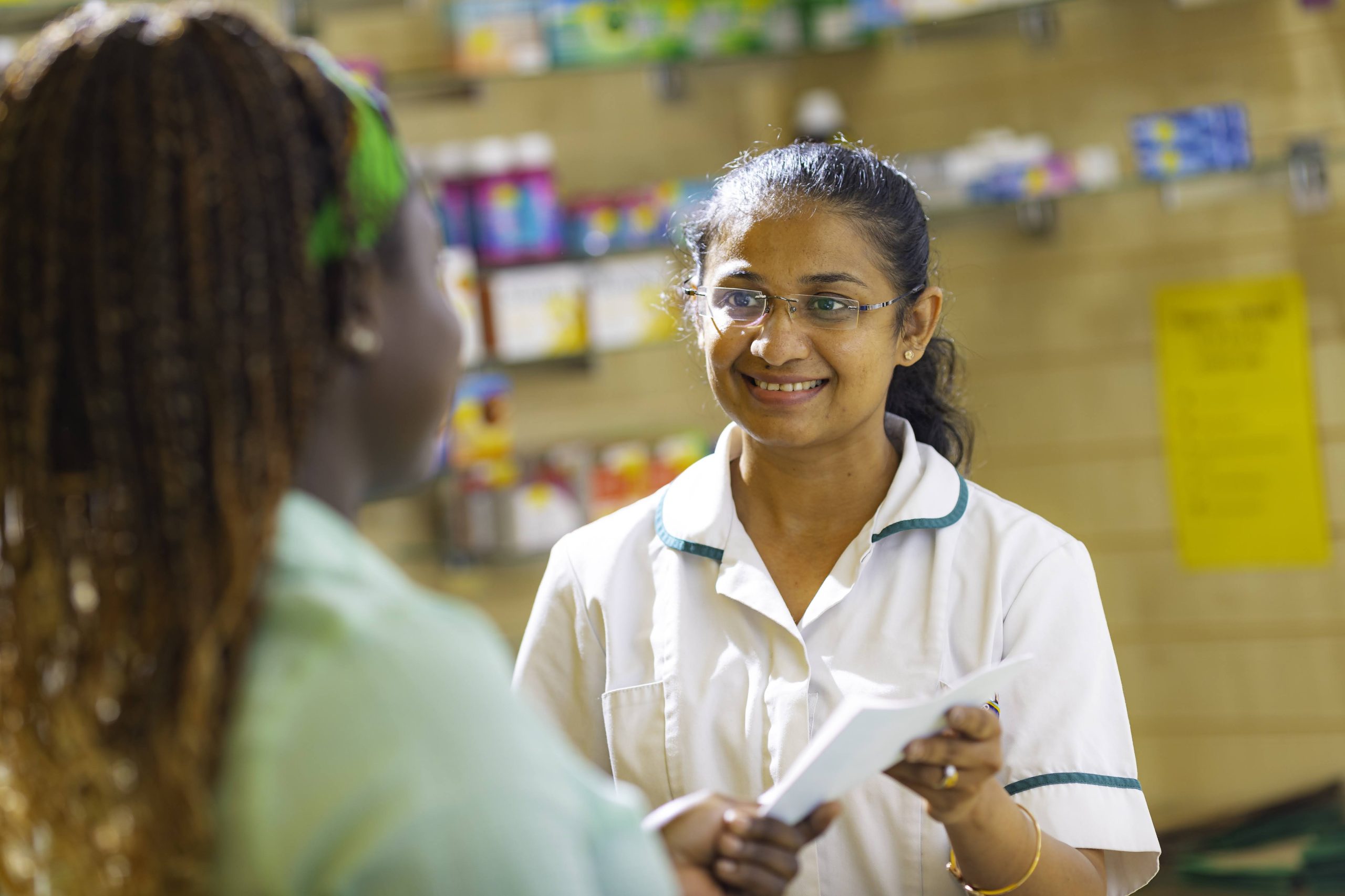 A pharmacist talking to a patient