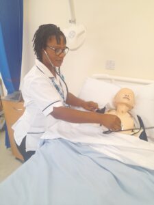 Suzie Sackey Photograph of apprentice Suzie using the simulation suite equipment.